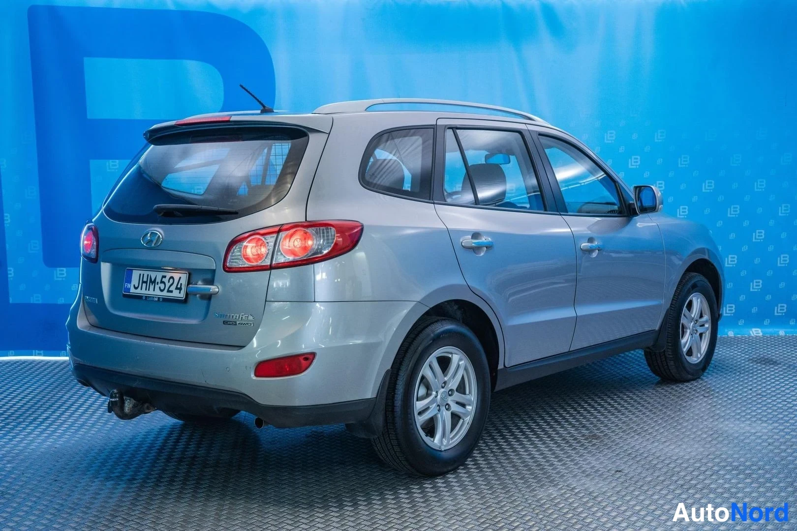 Silver Hyundai Santa Fe 2011, rear three-quarter, photo 4