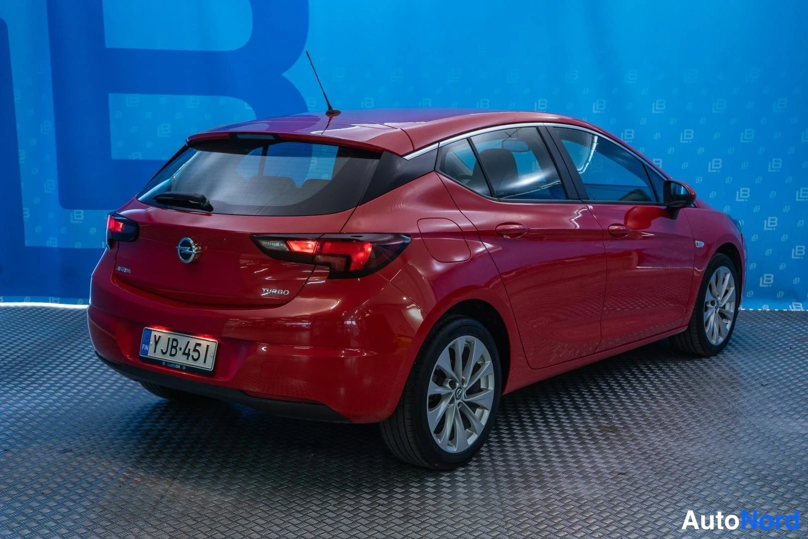 Red Opel Astra 2016, rear three-quarter, photo 4
