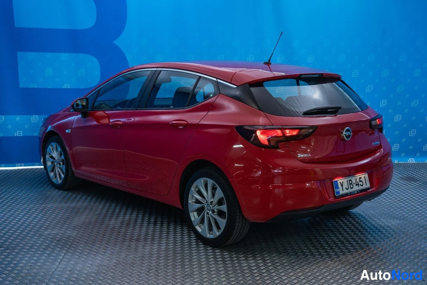 Red Opel Astra 2016, rear three-quarter, photo 5