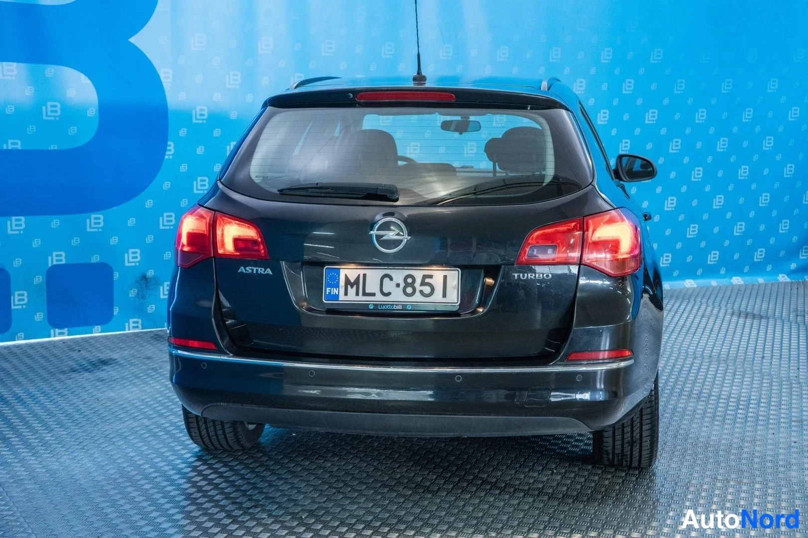 Black Opel Astra 2013, rear, photo 6