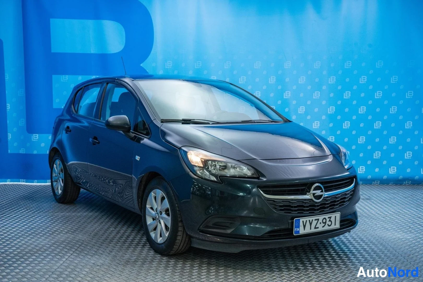 Green Opel Corsa 2016, front three-quarter, nose to the right, photo 3
