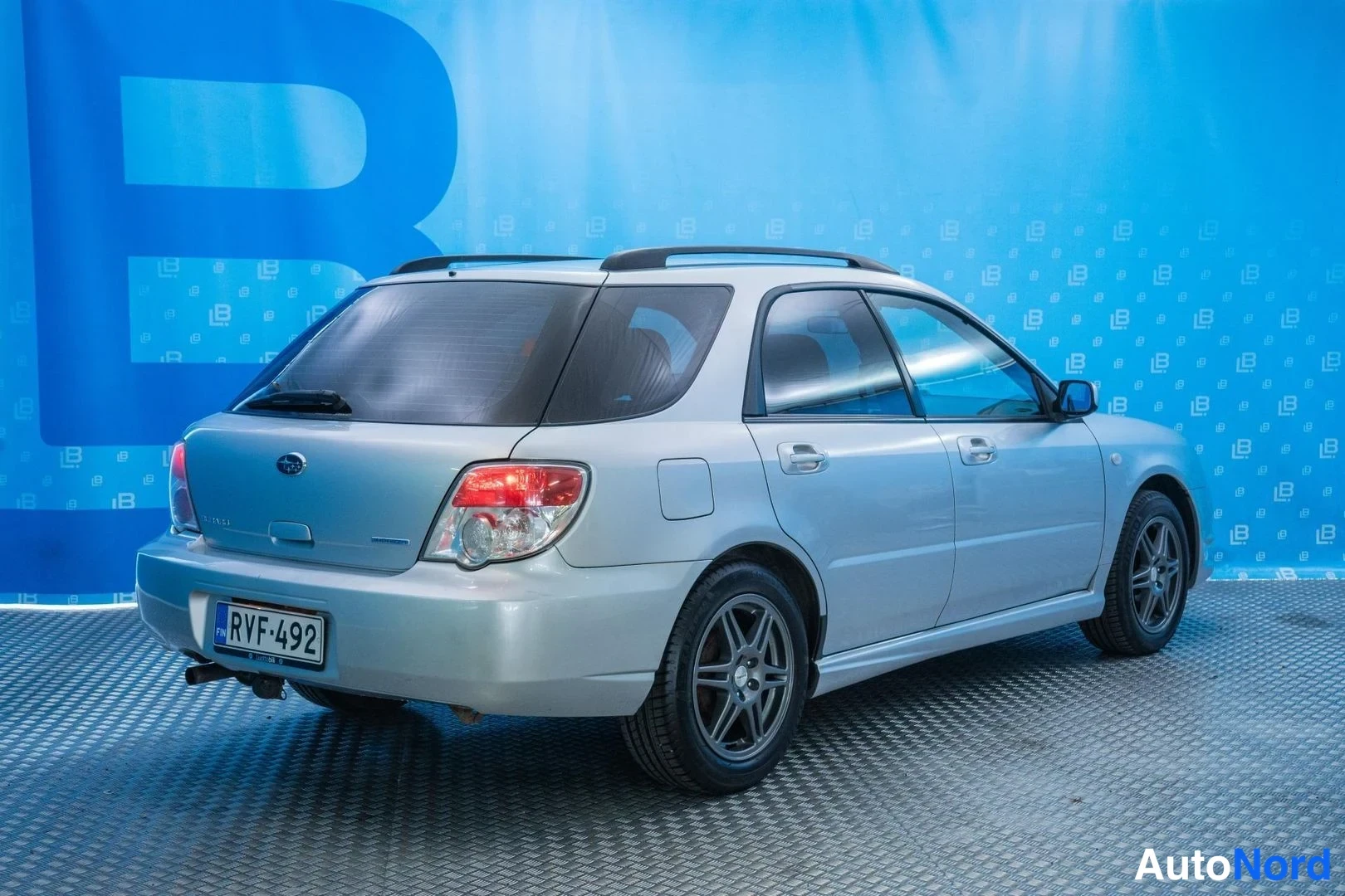 Silver Subaru Impreza 2007, rear three-quarter, photo 4