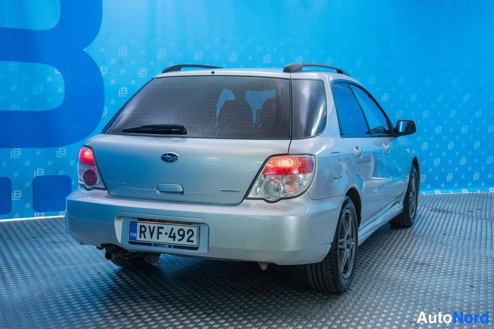 Silver Subaru Impreza 2007, rear three-quarter, photo 5