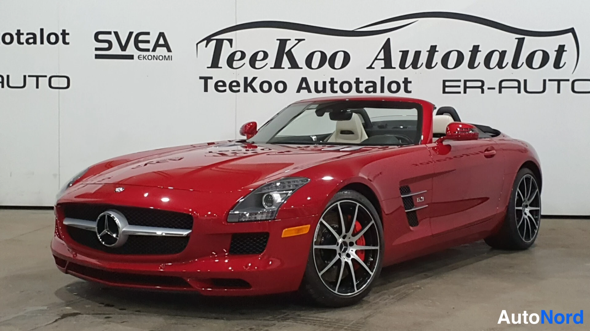 Red Mercedes-Benz SLS AMG 2013, front three-quarter, nose to the left, photo 2