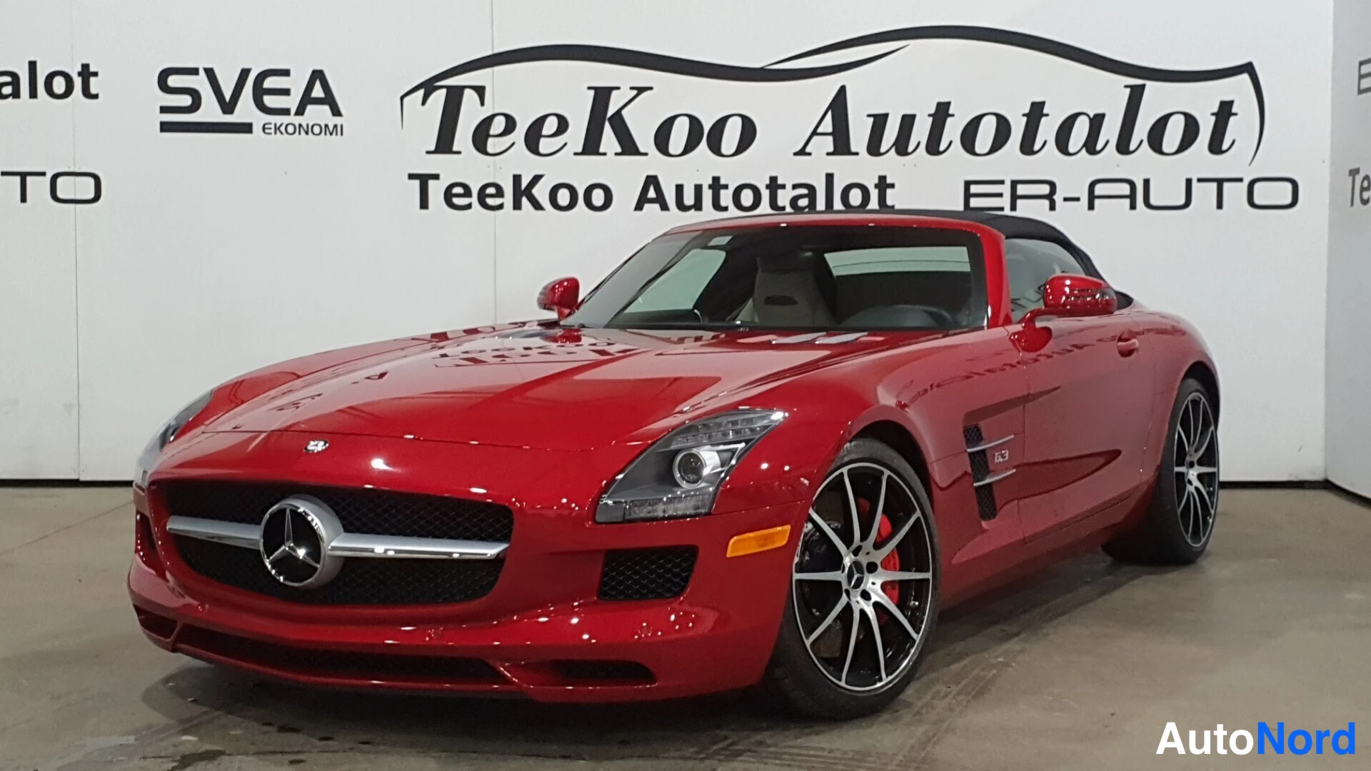 Red Mercedes-Benz SLS AMG 2013, front three-quarter, nose to the left, photo 3