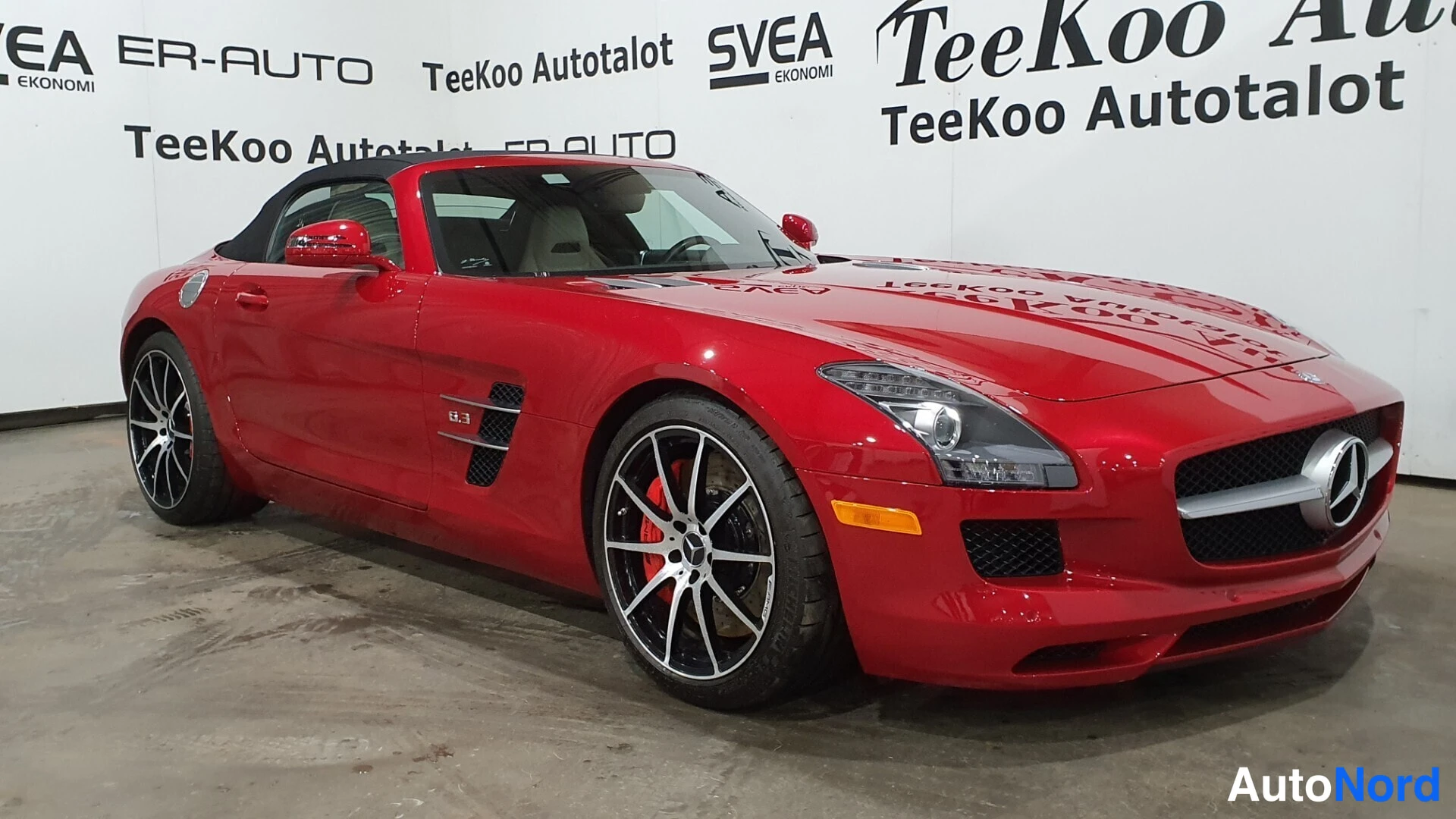 Red Mercedes-Benz SLS AMG 2013, front three-quarter, nose to the right, photo 5