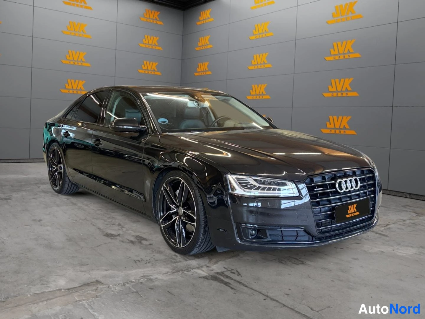 Black Audi A8 2015, front three-quarter, nose to the right, photo 3