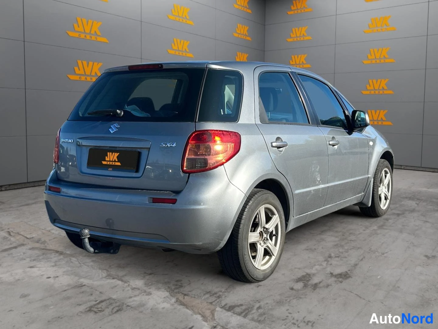 Grey Suzuki SX4 2011, rear three-quarter, photo 5