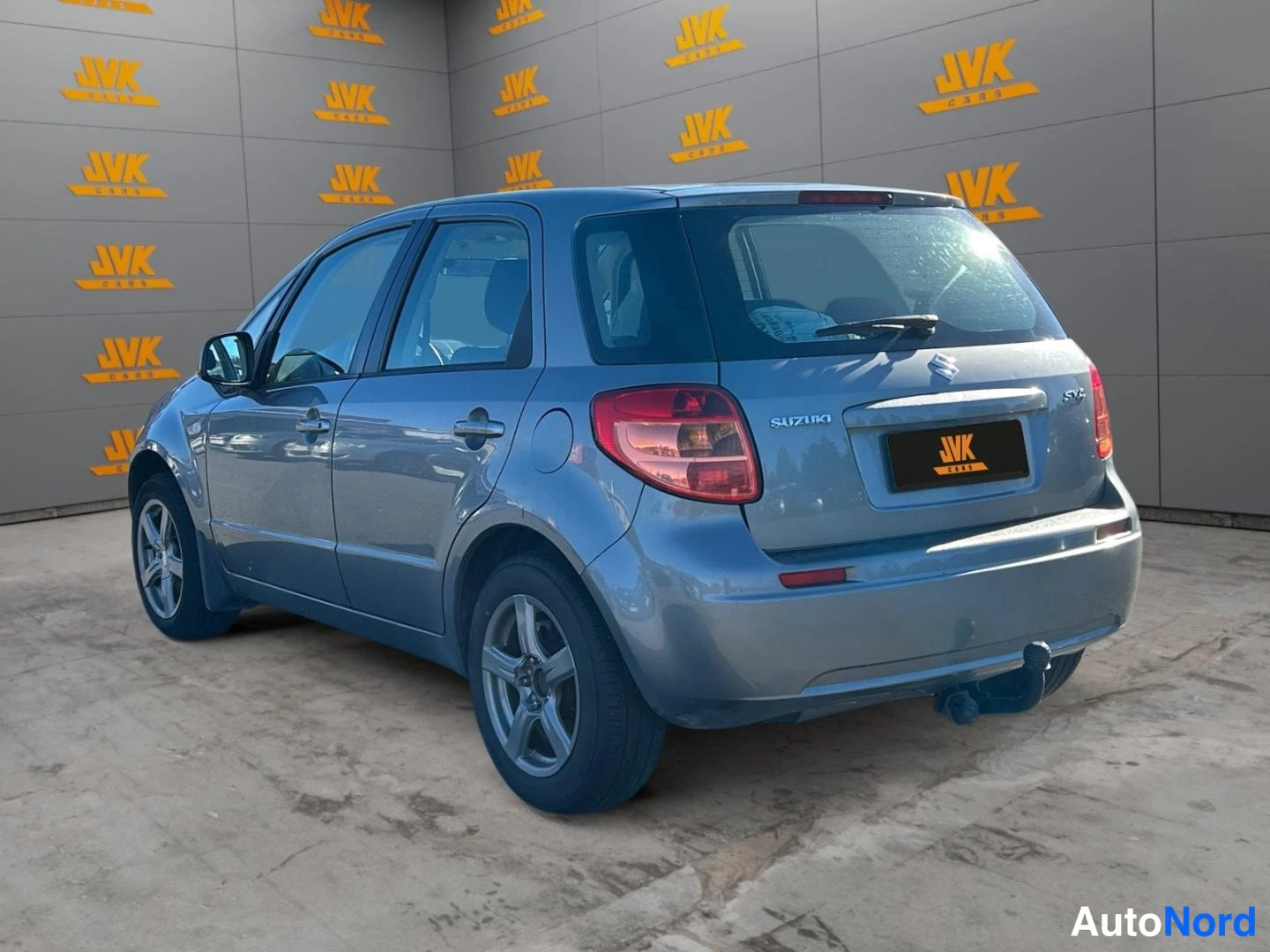 Grey Suzuki SX4 2011, rear three-quarter, photo 6
