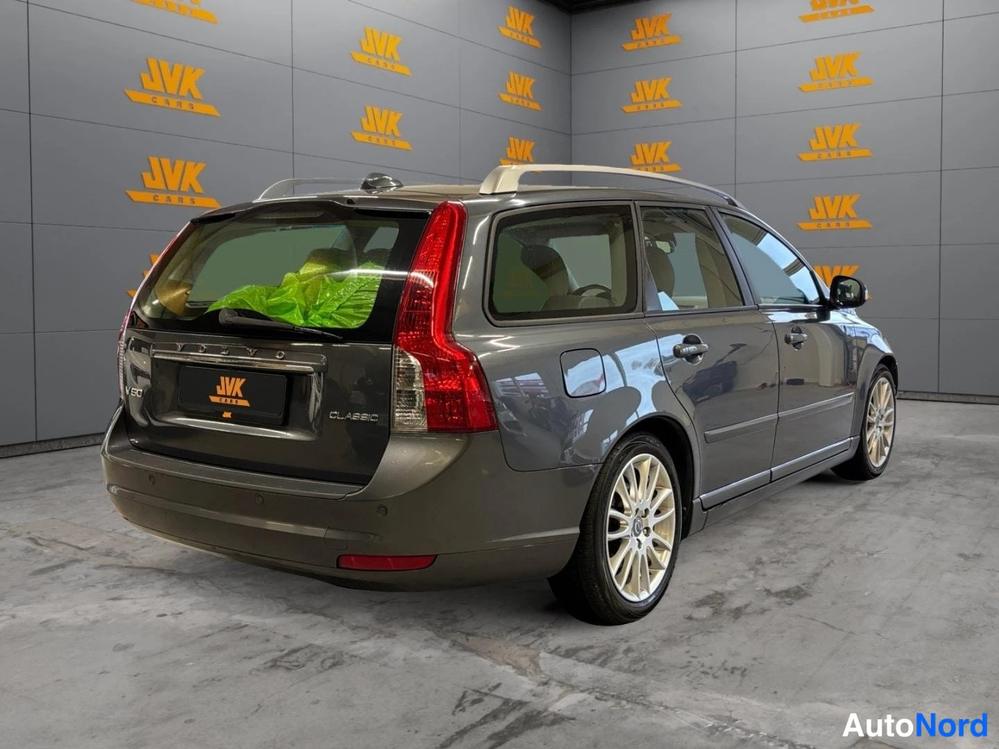 Grey Volvo V50 2011, rear three-quarter, photo 5