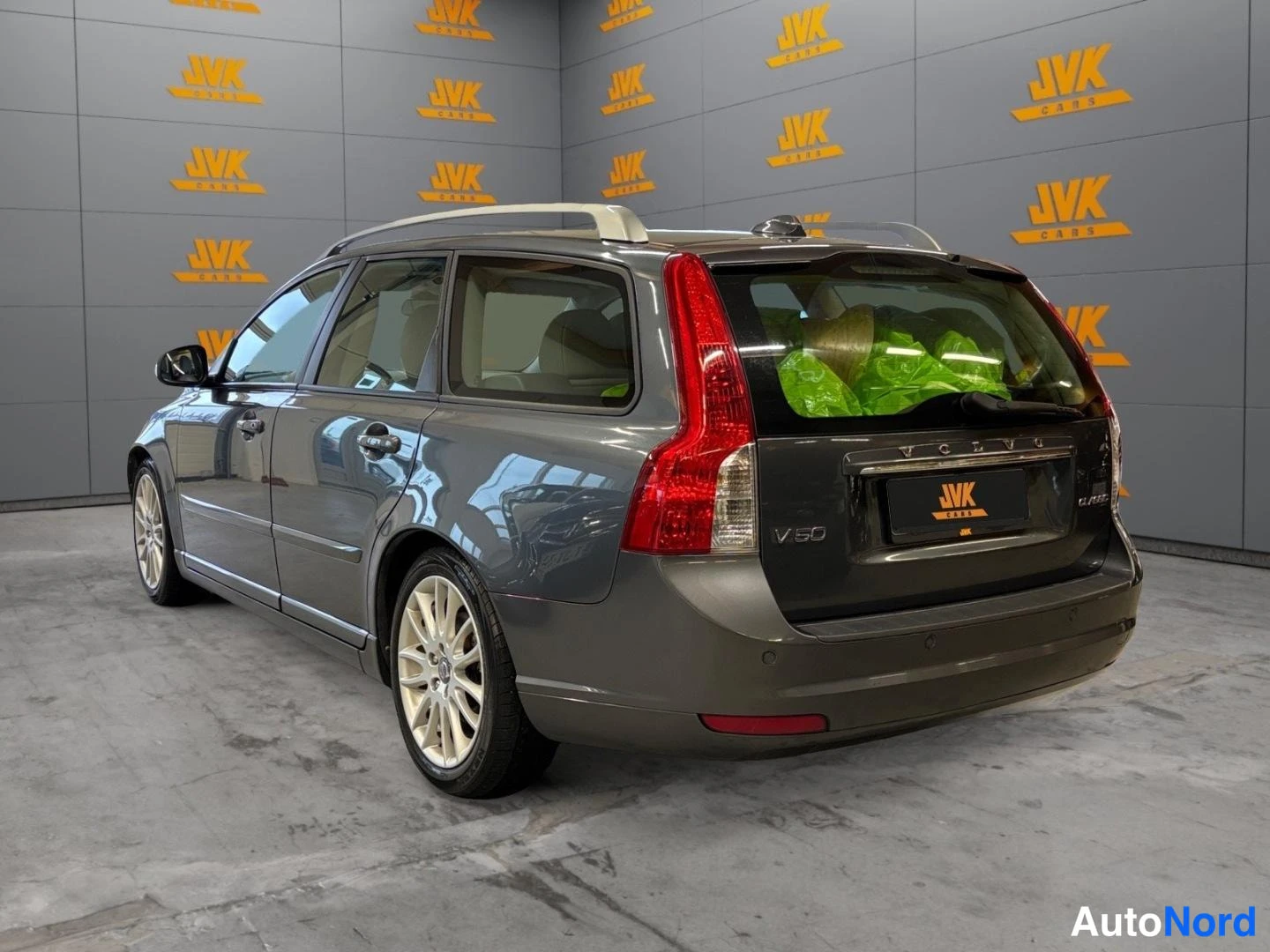 Grey Volvo V50 2011, rear three-quarter, photo 6