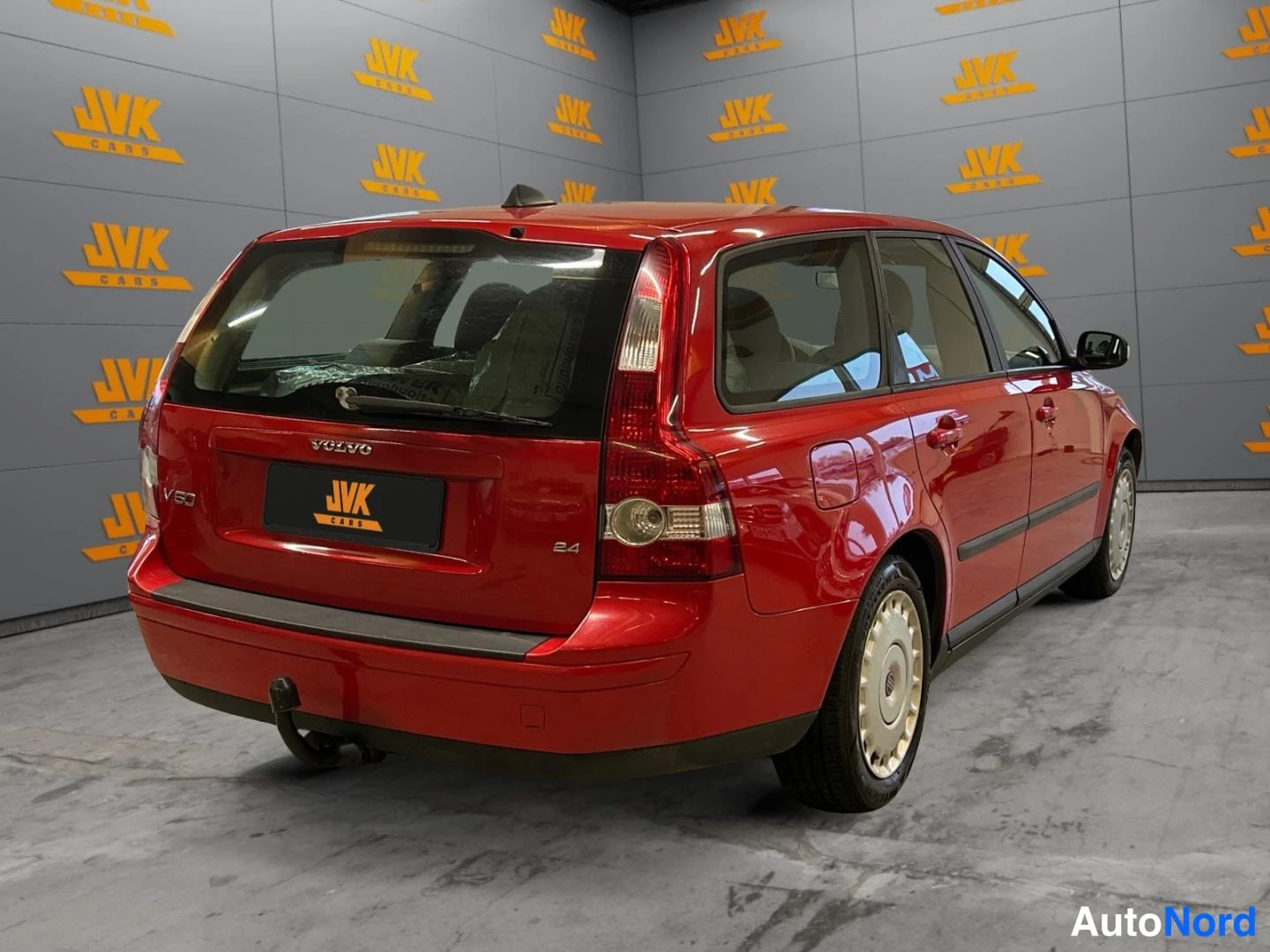 Red Volvo V50 2007, rear three-quarter, photo 5