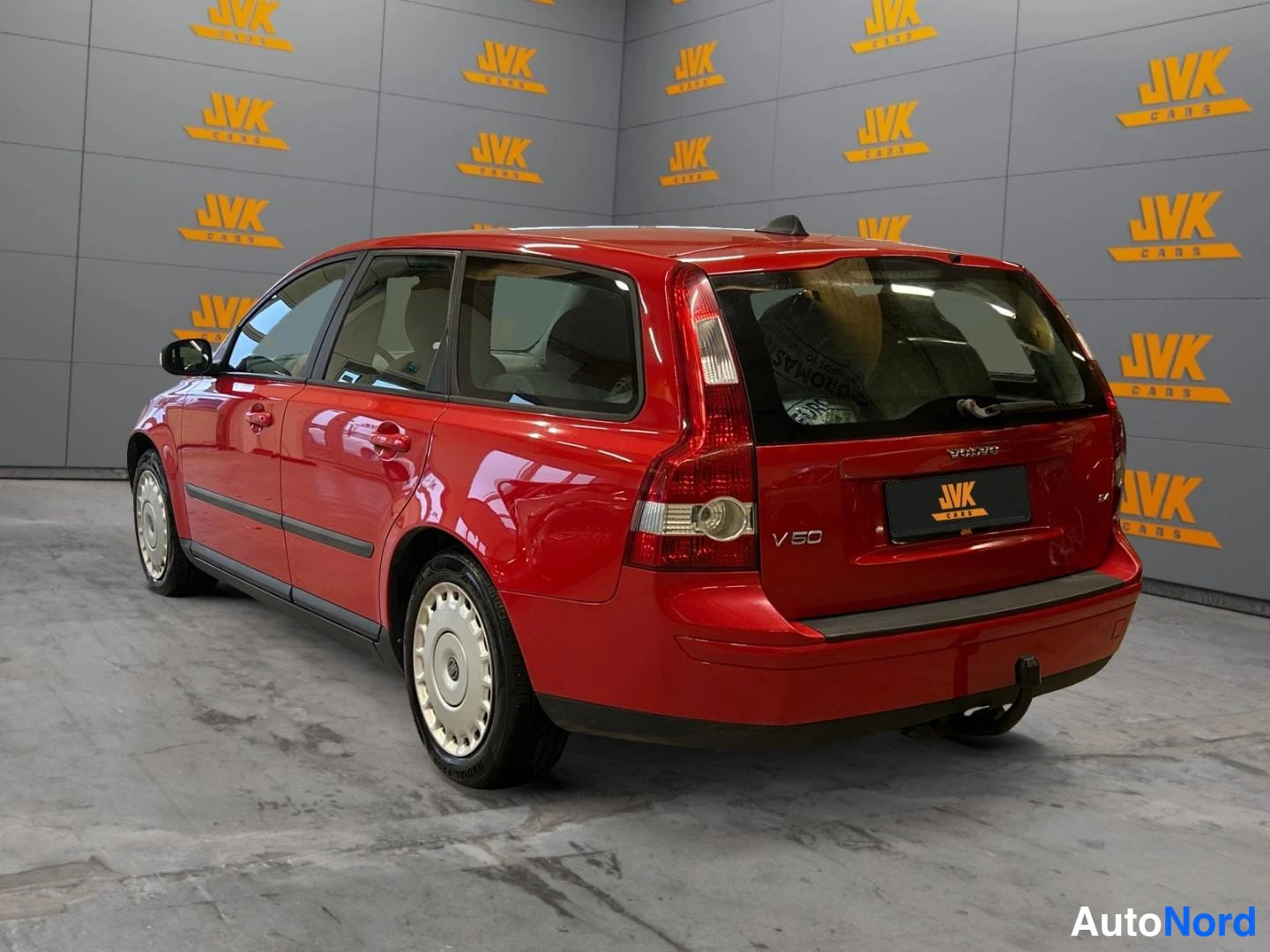 Red Volvo V50 2007, rear three-quarter, photo 6