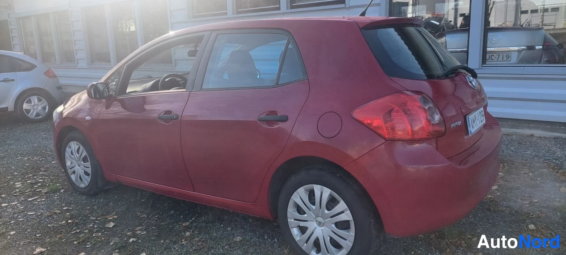Red Toyota Auris 2008, rear three-quarter, photo 4