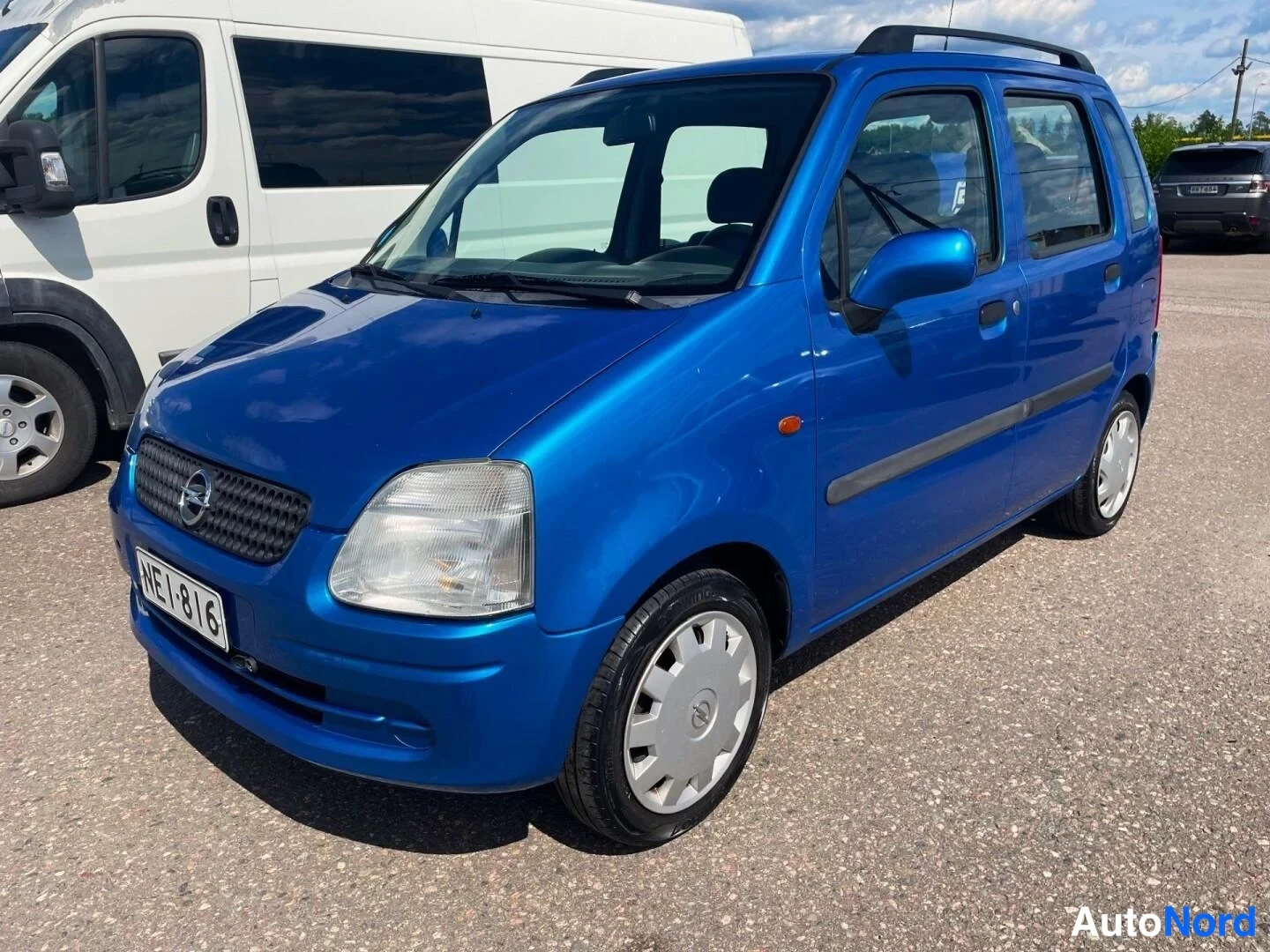 Blå Opel Agila 2001, snett framifrån, fronten åt vänster, bild 3