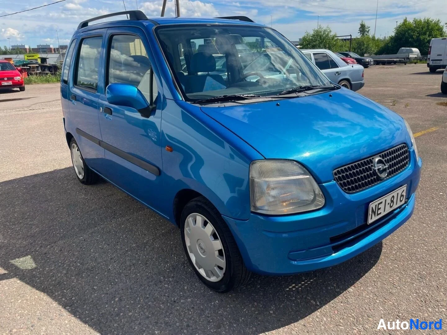 Blå Opel Agila 2001, snett framifrån, fronten åt höger, bild 6