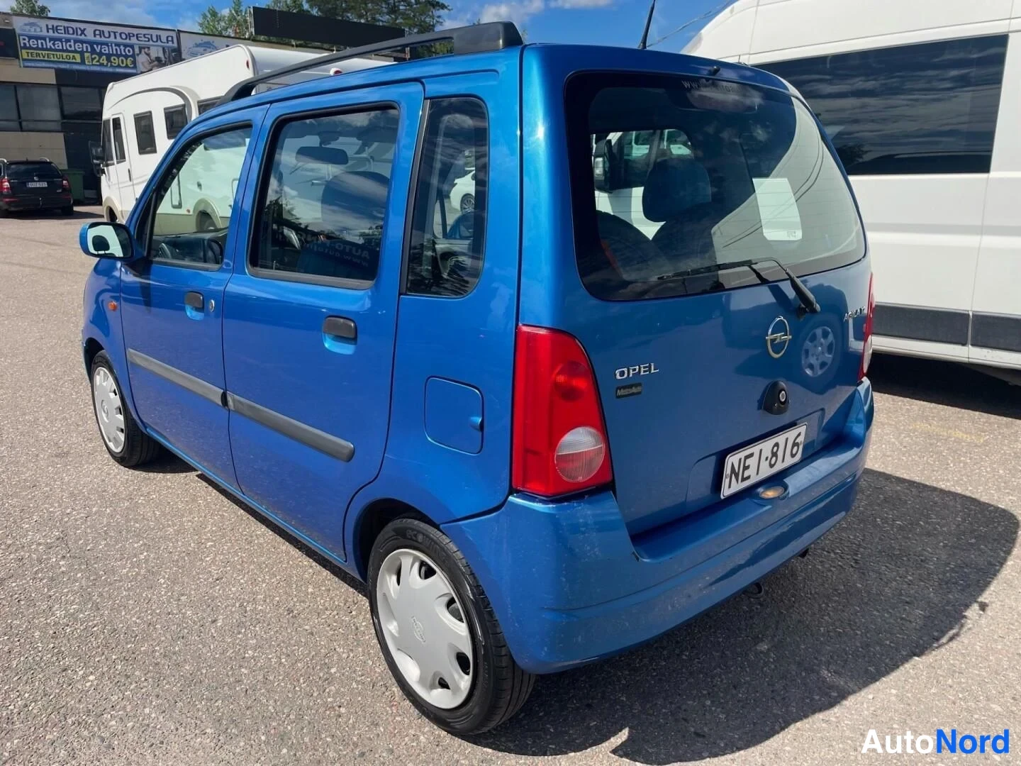 Blå Opel Agila 2001, snett bakifrån, bild 11