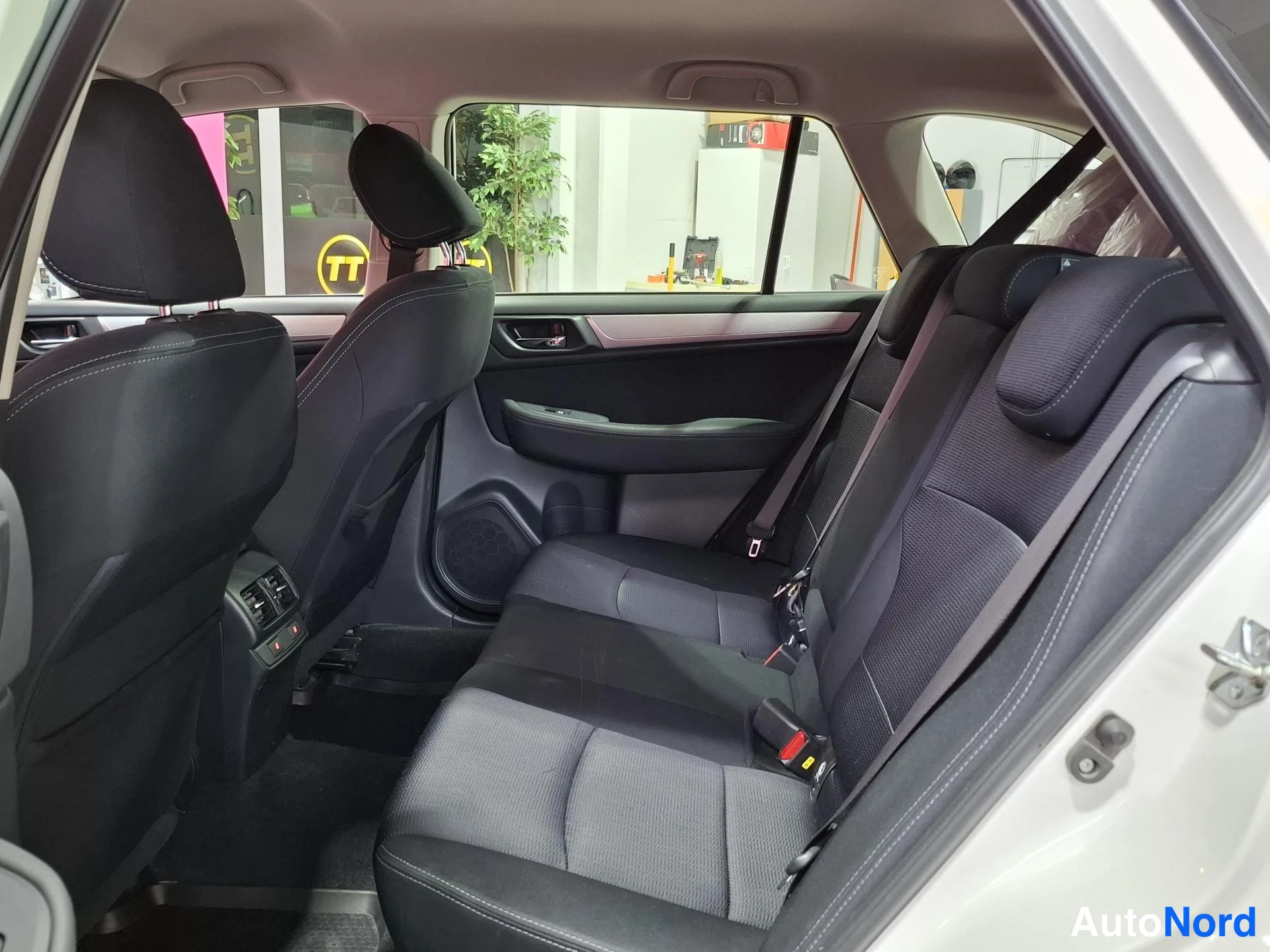 White Subaru Outback 2015, rear seats, photo 11