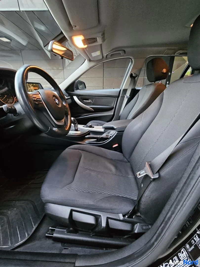 Musta BMW 320i xDrive 2015, etuistuimet, kuva 16