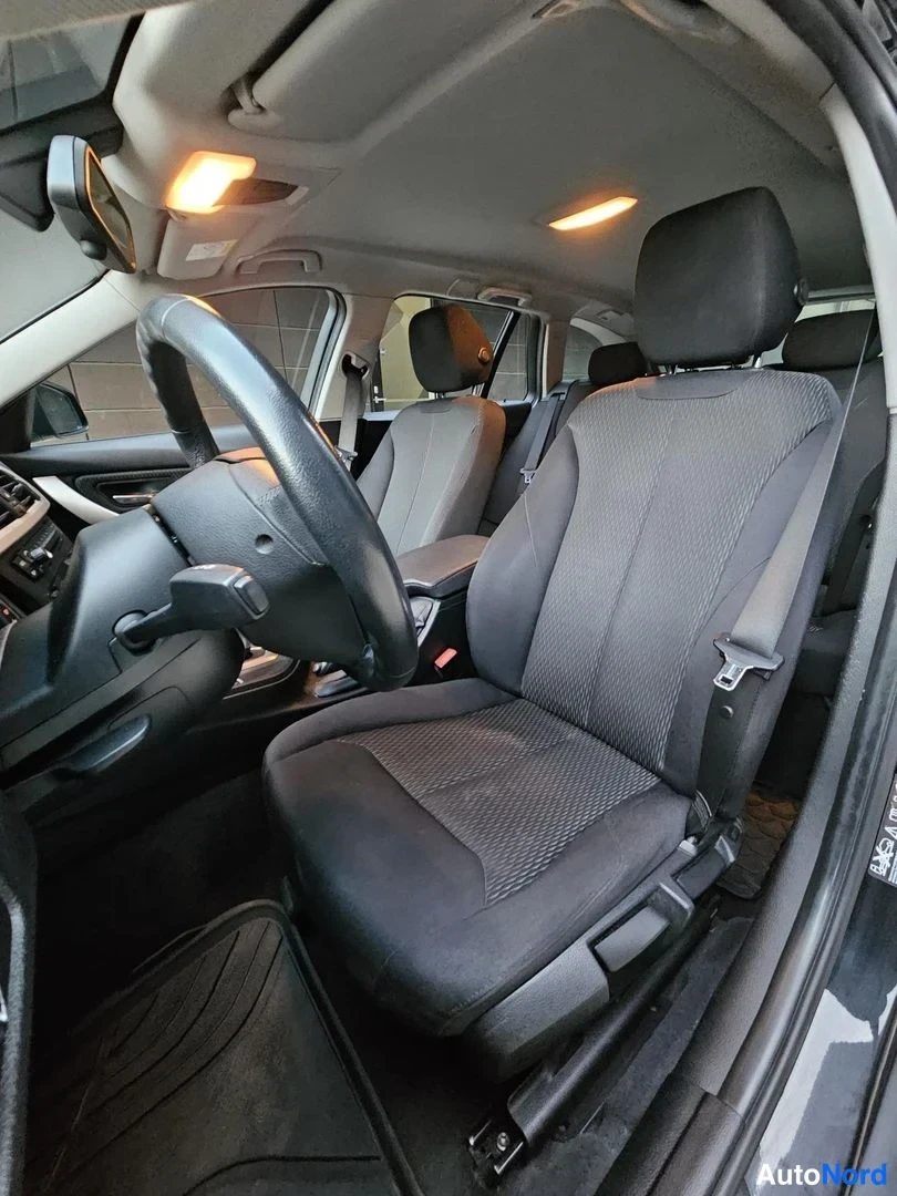 Musta BMW 320i xDrive 2015, etuistuimet, kuva 17