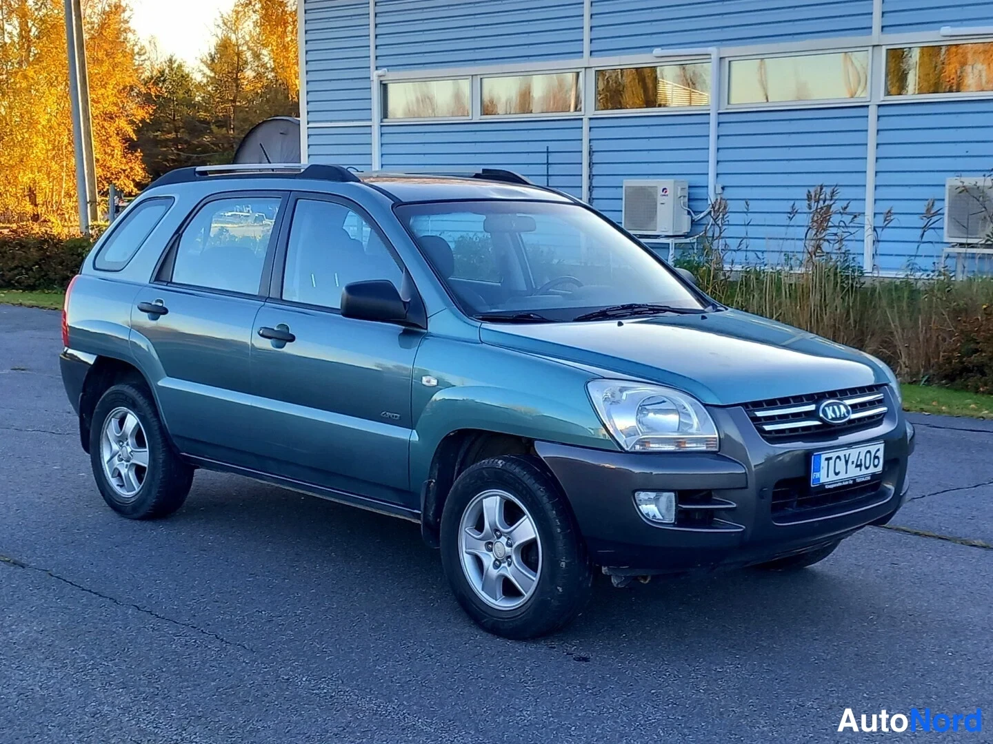 Vihreä Kia Sportage 2007, etuviisto, keula oikealle, kuva 4