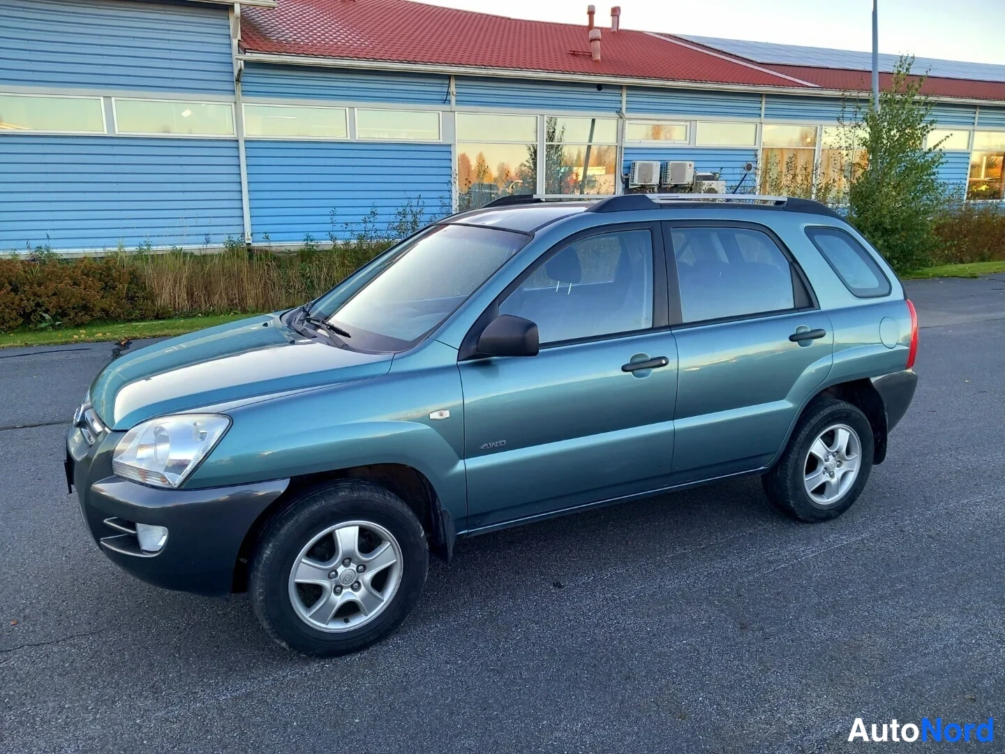 Vihreä Kia Sportage 2007, etuviisto, keula vasemmalle, kuva 2