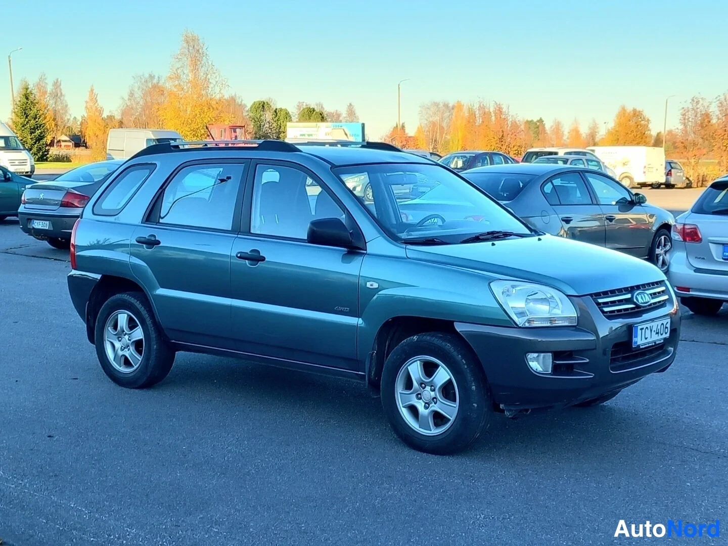 Vihreä Kia Sportage 2007, etuviisto, keula oikealle, kuva 5