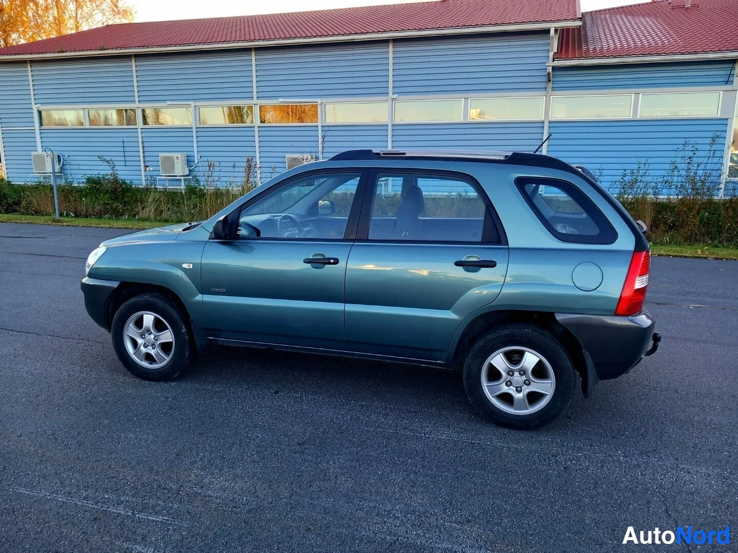Vihreä Kia Sportage 2007, etuviisto, keula vasemmalle, kuva 3