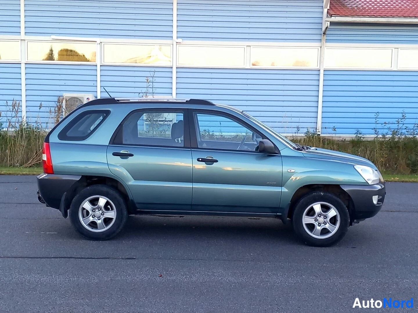 Vihreä Kia Sportage 2007, etuviisto, keula oikealle, kuva 6