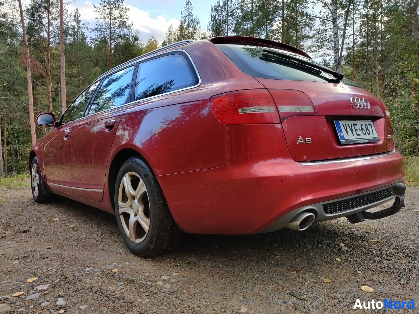 Röd Audi A6 Avant 2010, snett bakifrån, bild 16