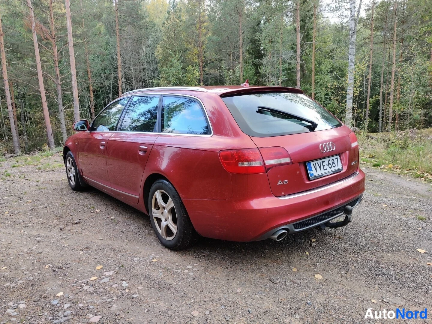Röd Audi A6 Avant 2010, snett bakifrån, bild 19