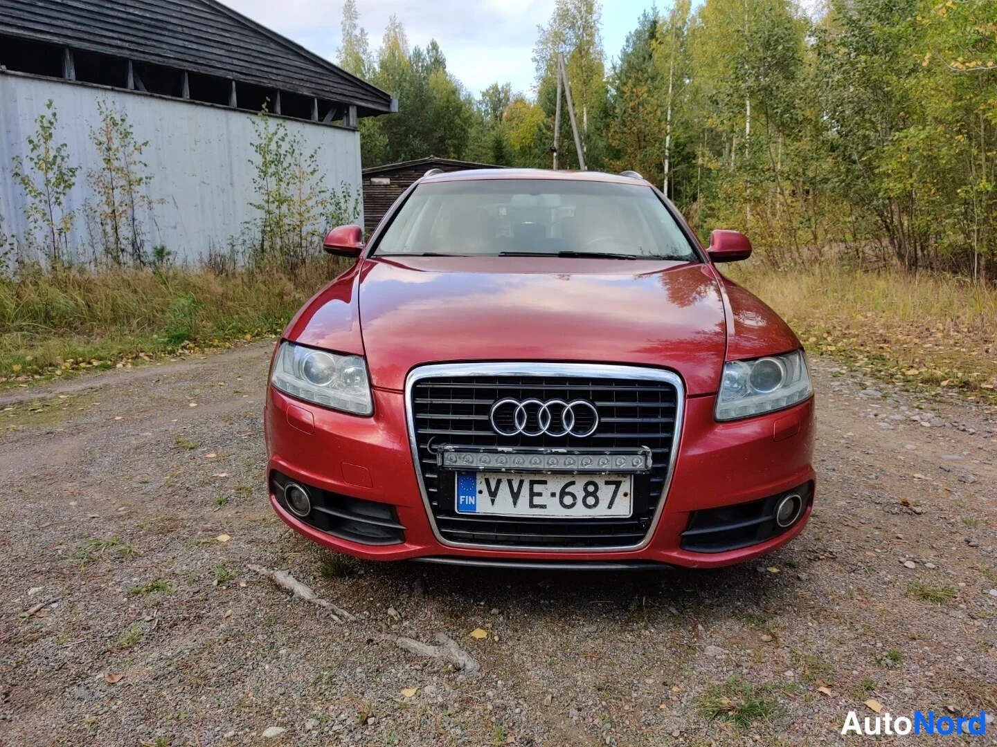 Röd Audi A6 Avant 2010, framifrån, bild 9
