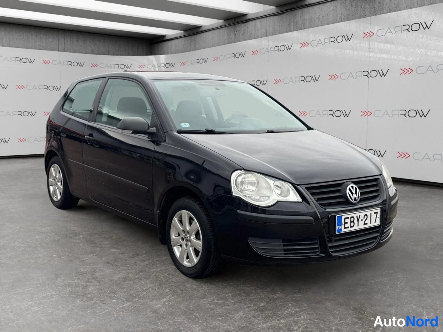 Musta Volkswagen Polo 2008, etuviisto, keula oikealle, kuva 2