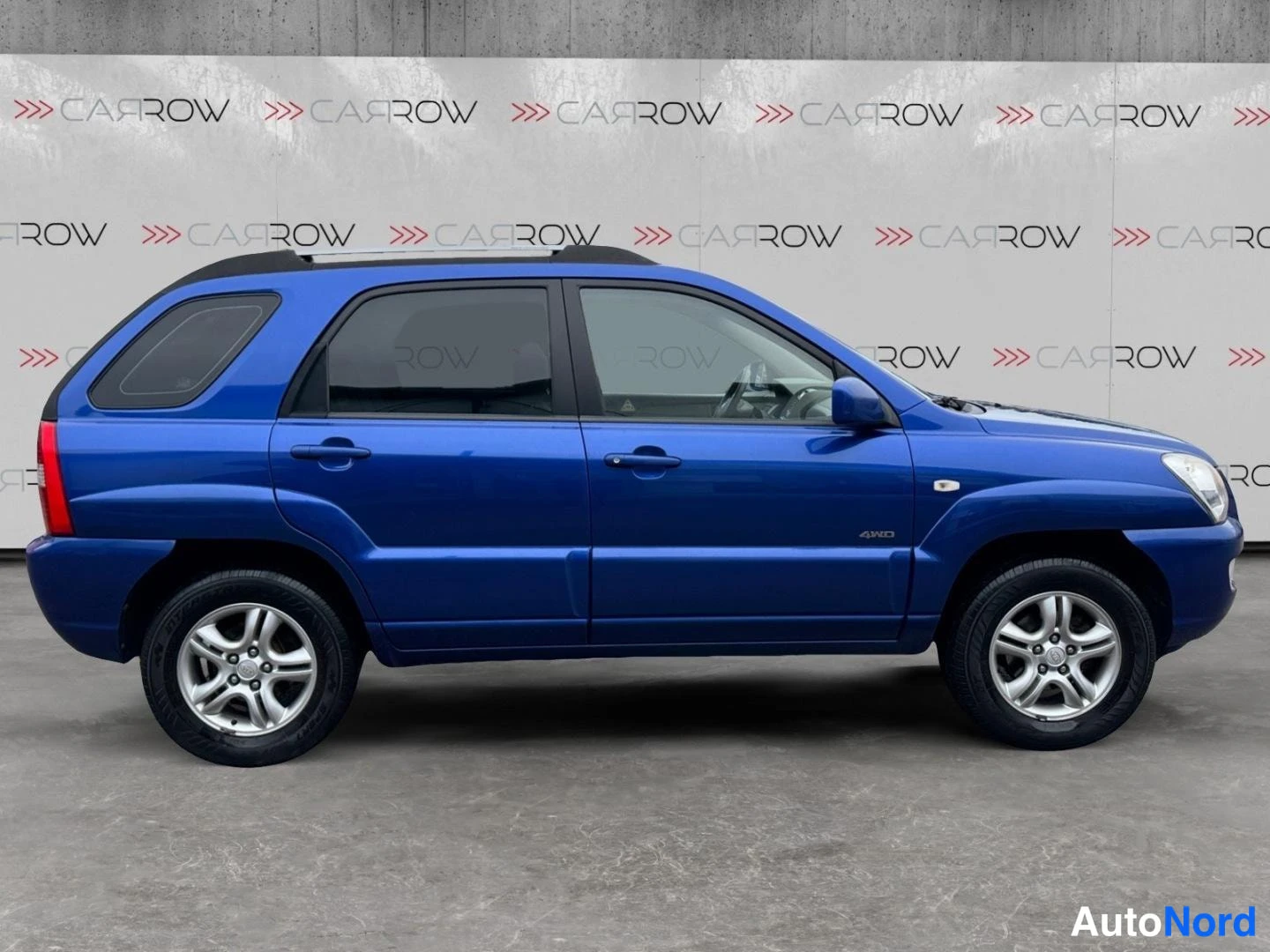 Sininen Kia Sportage 2006, sivulta, kuva 5
