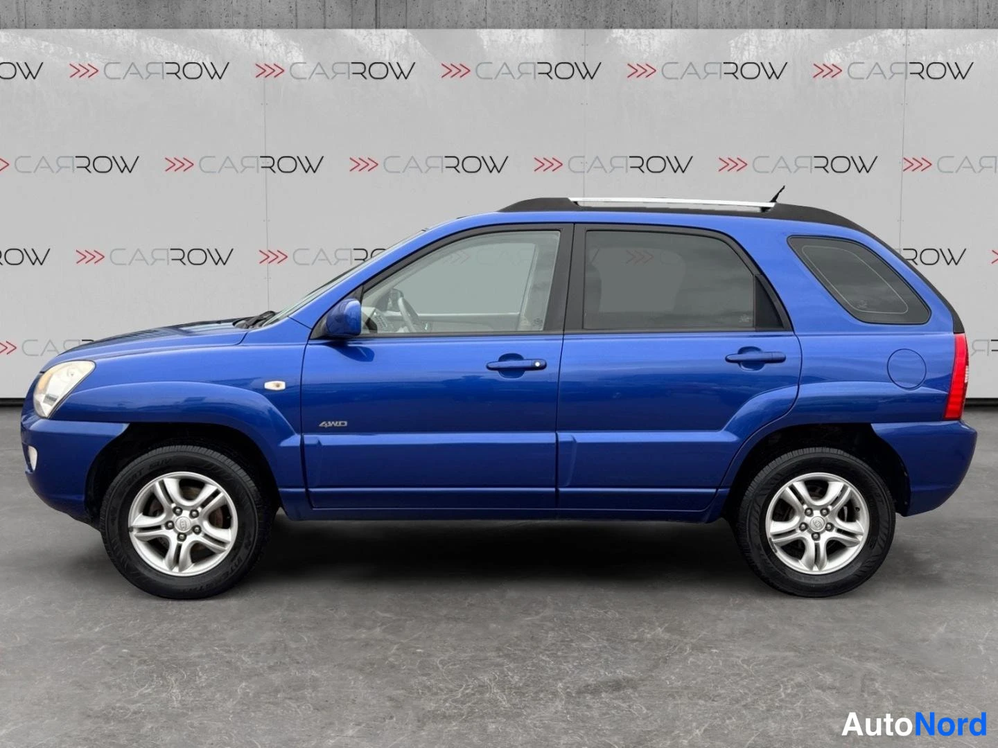 Sininen Kia Sportage 2006, sivulta, kuva 4