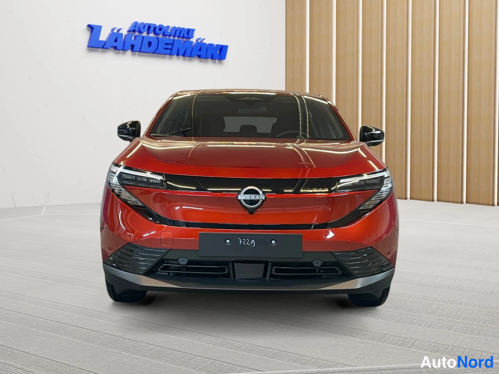 Red Nissan Leaf 2026, front, photo 3