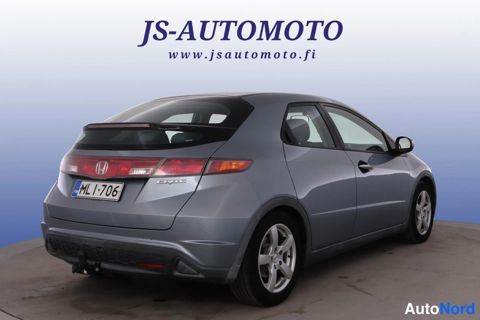 Blå Honda Civic 2007, snett bakifrån, bild 5