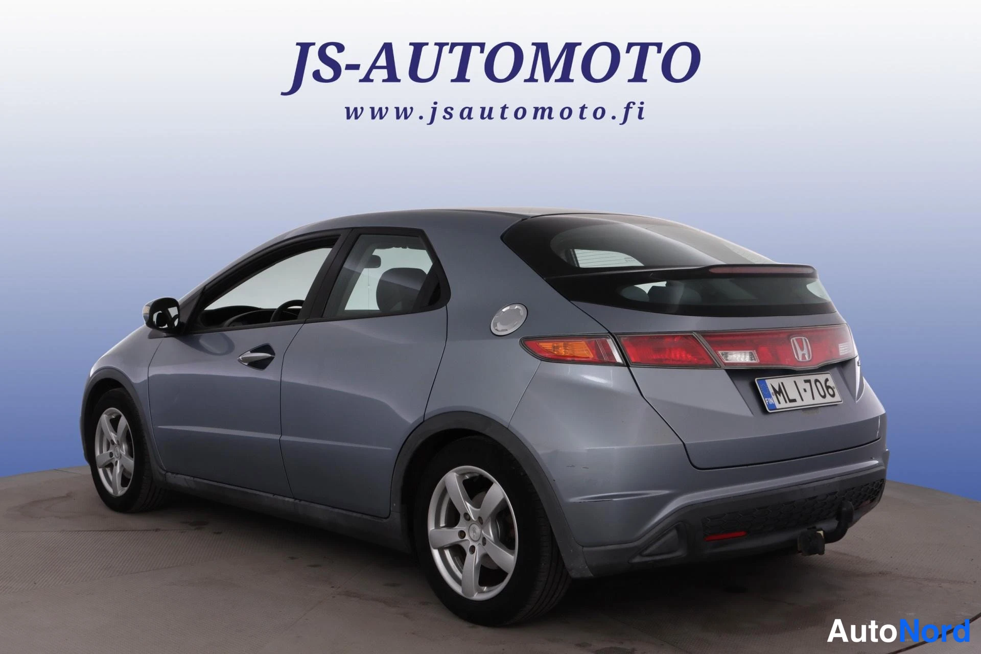 Blå Honda Civic 2007, snett bakifrån, bild 6