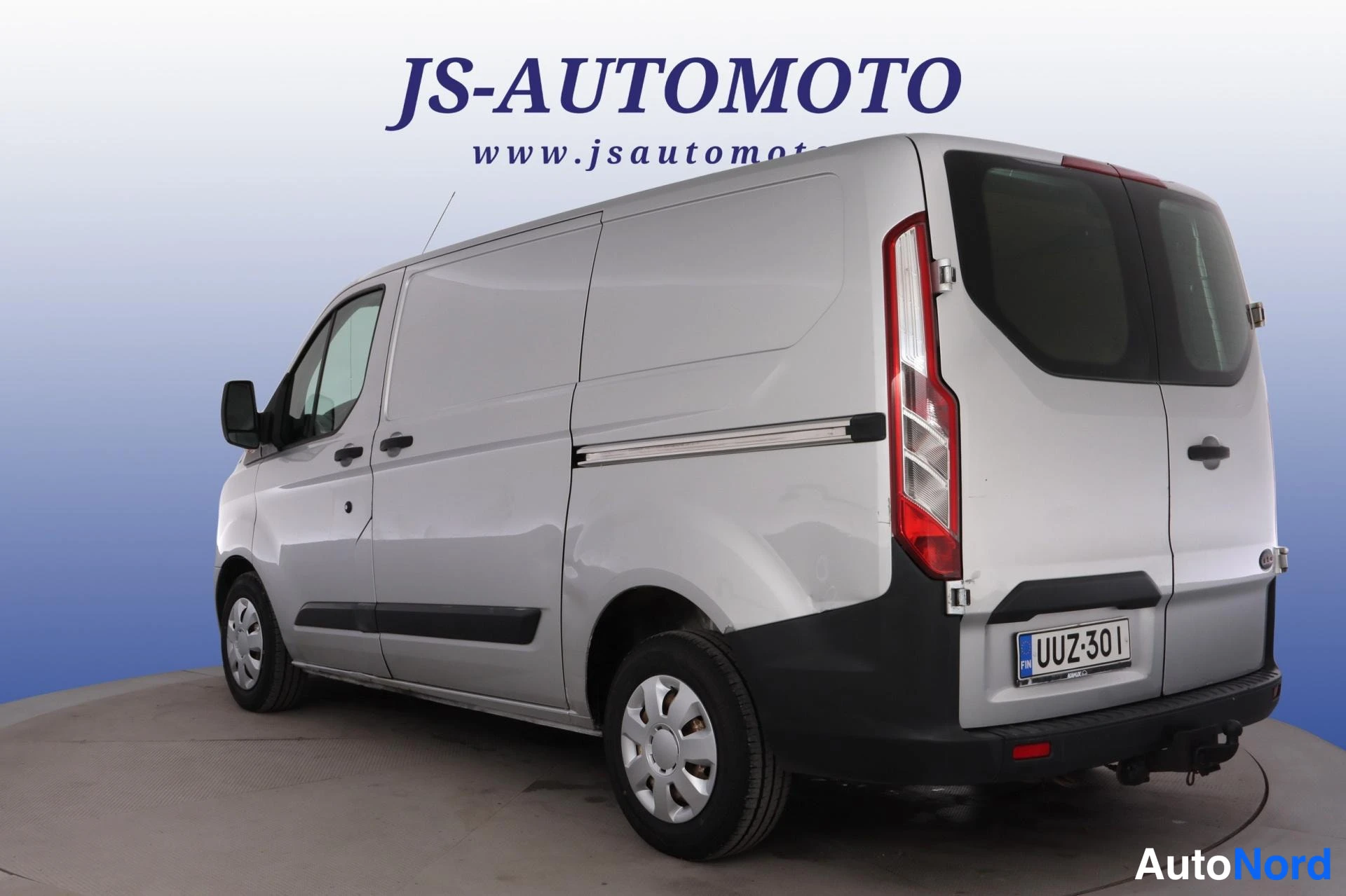 Grå Ford Transit Custom 2013, snett bakifrån, bild 6