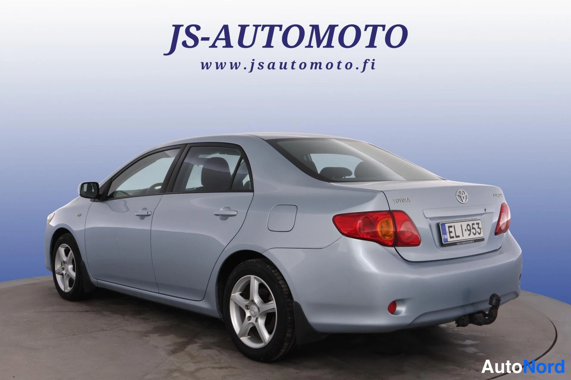 Blå Toyota Corolla 2010, snett bakifrån, bild 6