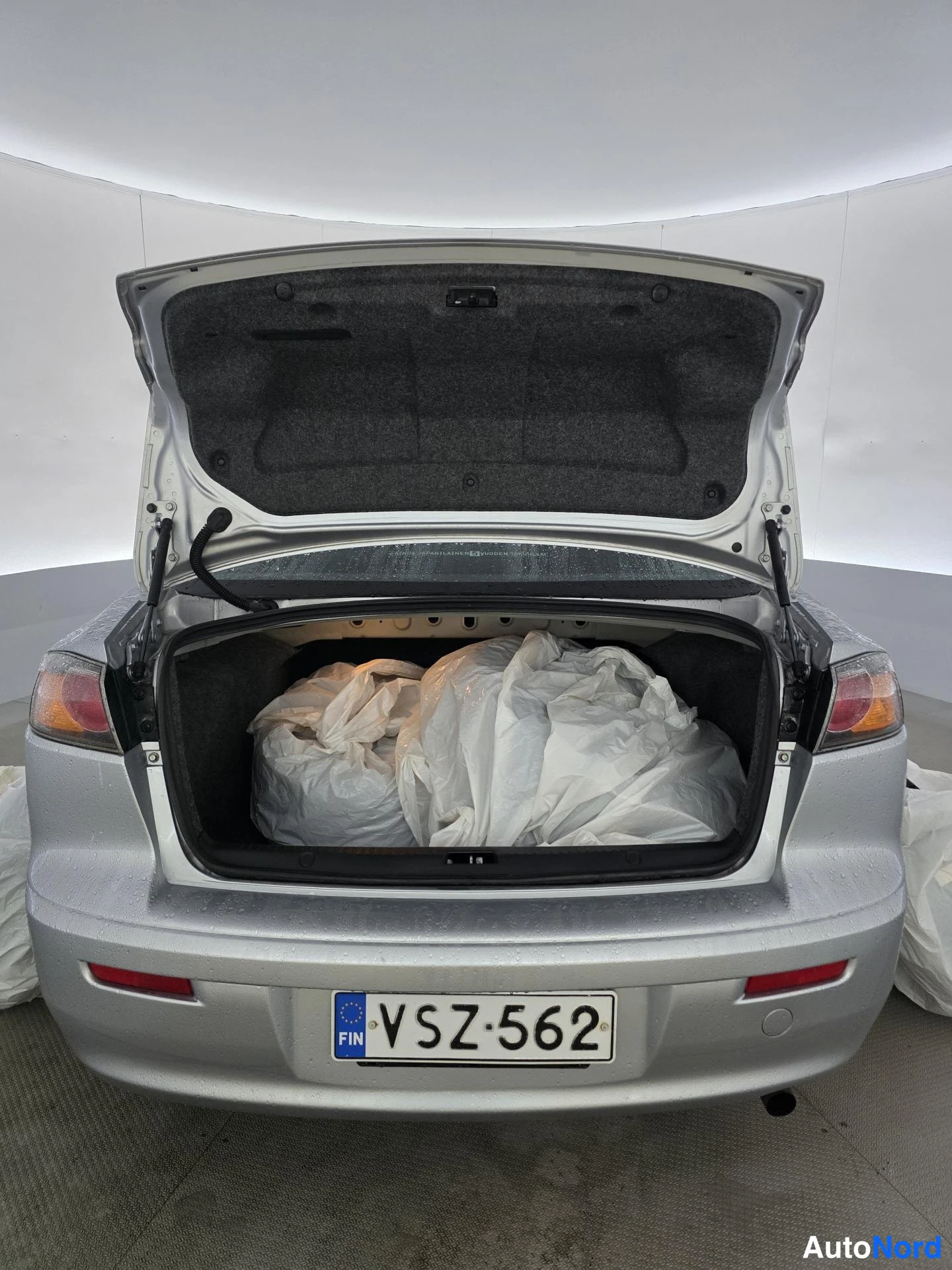 Harmaa Mitsubishi Lancer 2013, tavaratila, kuva 11