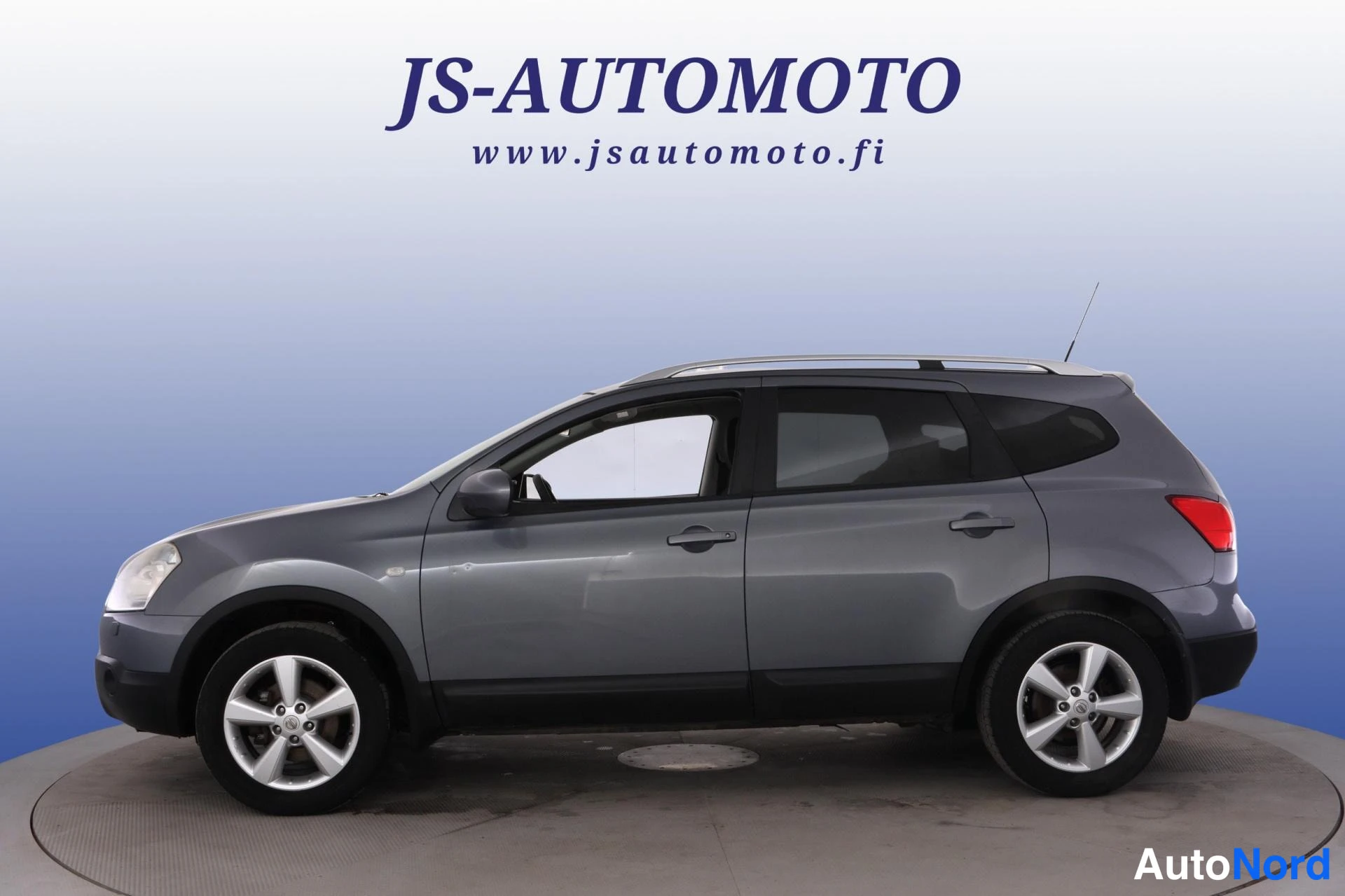 Sininen Nissan Qashqai+2 2009, sivulta, kuva 4