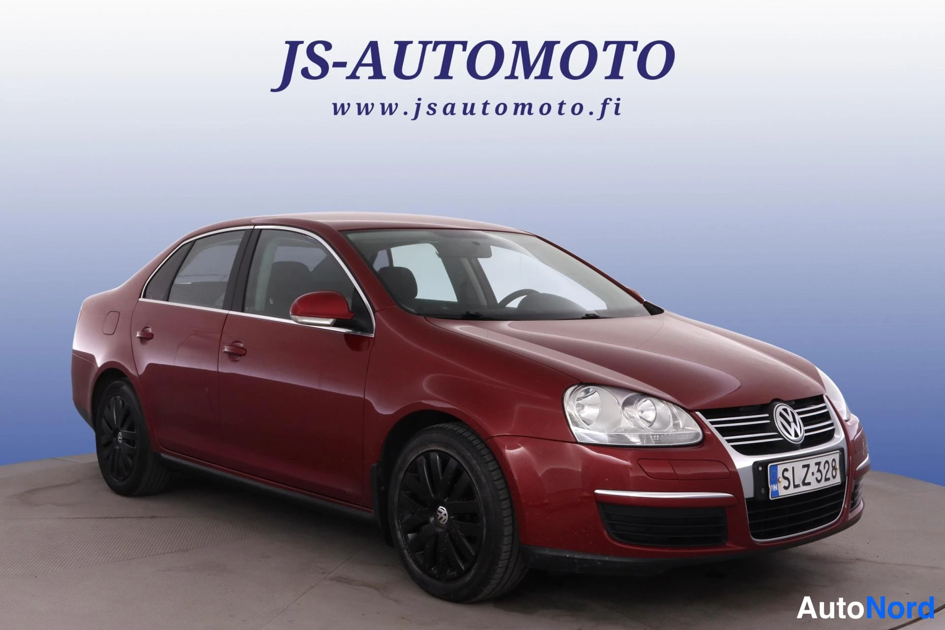 Punainen Volkswagen Jetta 2010, etuviisto, keula oikealle, kuva 4