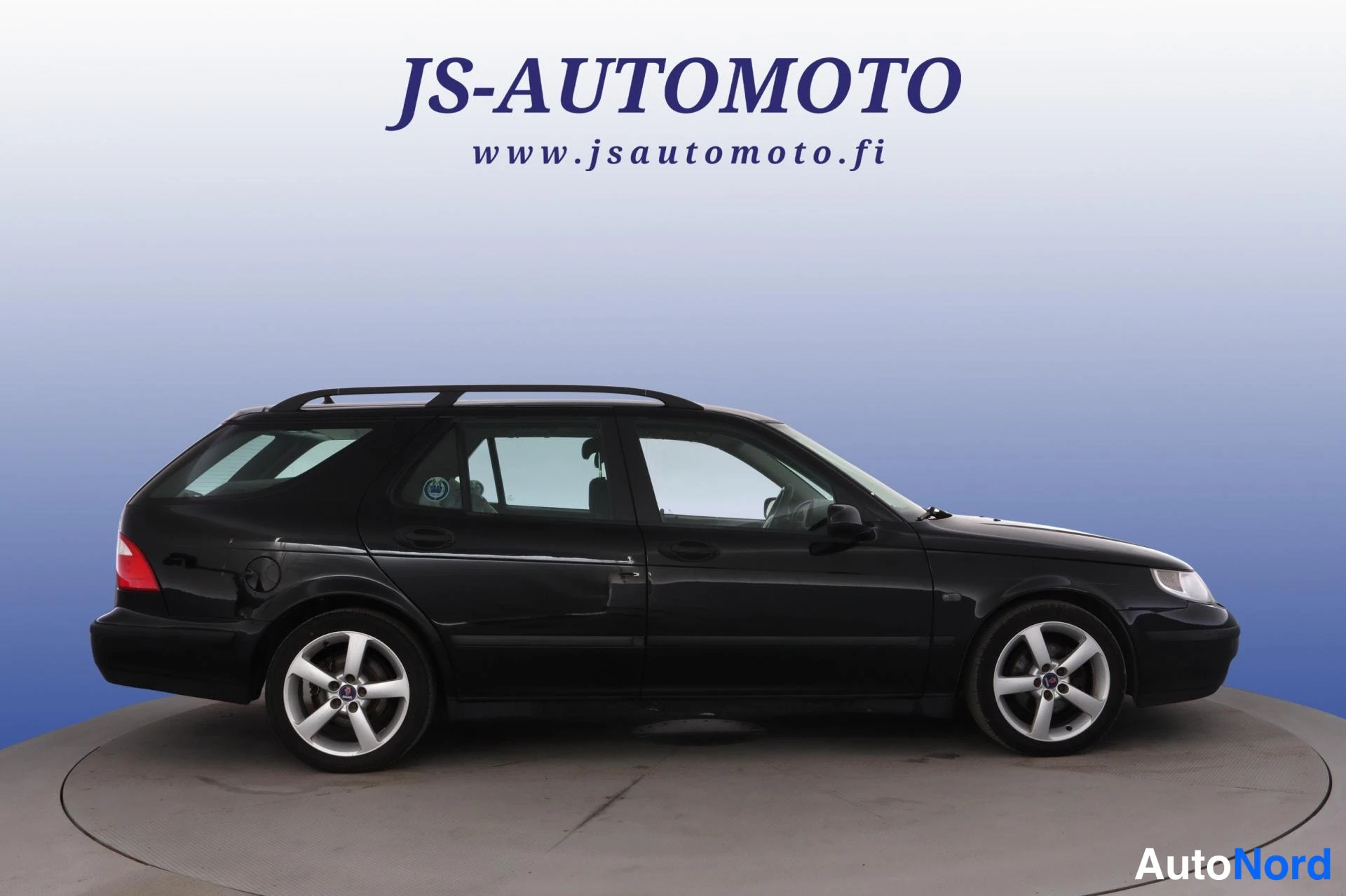 Svart Saab 9-5 2005, från sidan, bild 4