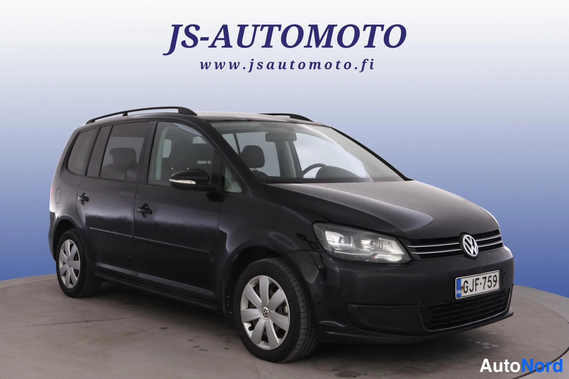 Musta Volkswagen Touran 2011, etuviisto, keula oikealle, kuva 4