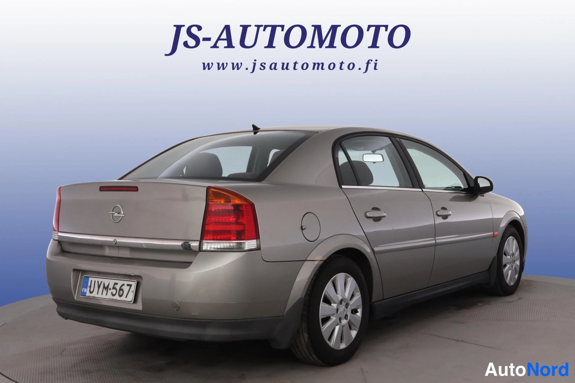 Grå Opel Vectra 2003, snett bakifrån, bild 5