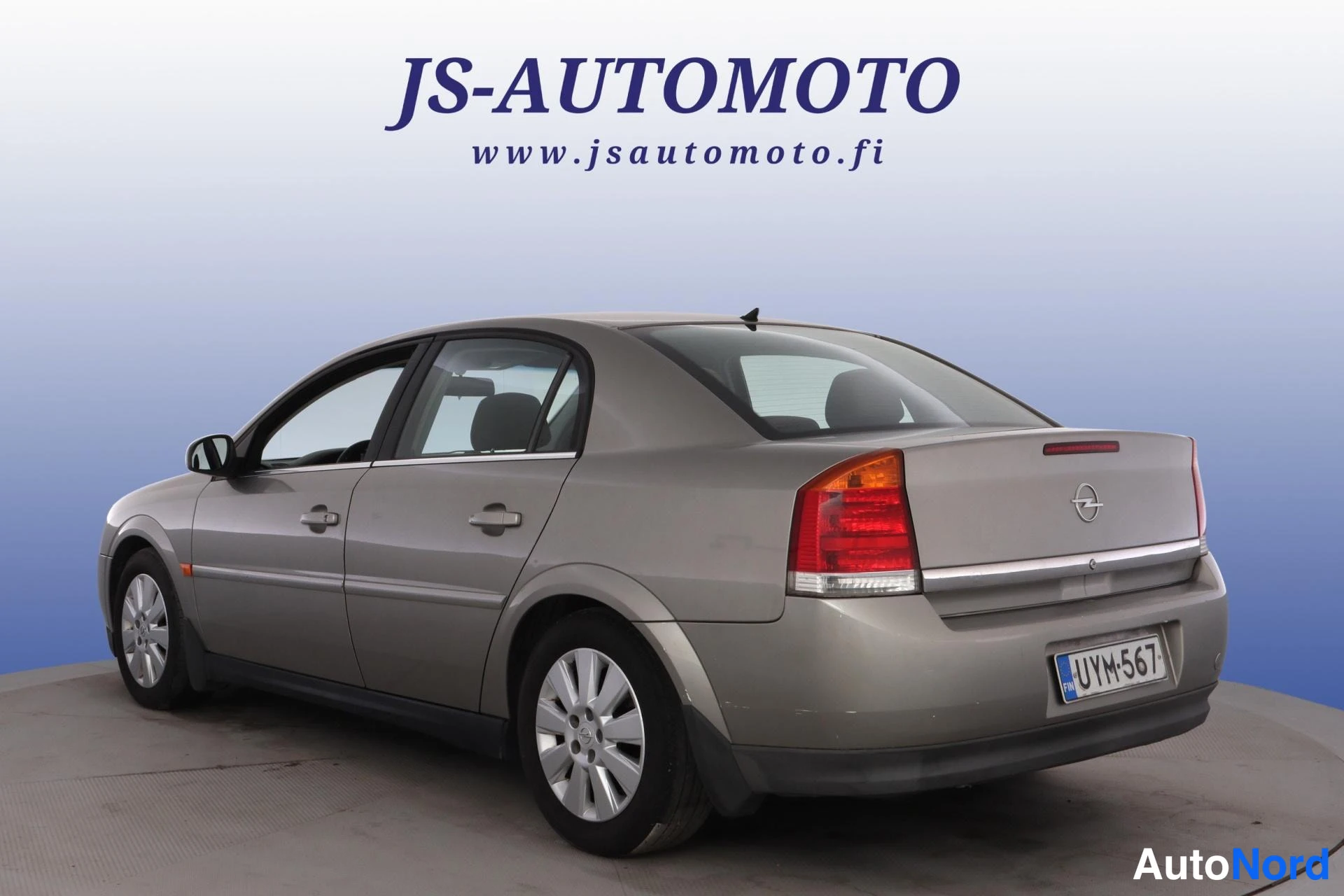 Grå Opel Vectra 2003, snett bakifrån, bild 6