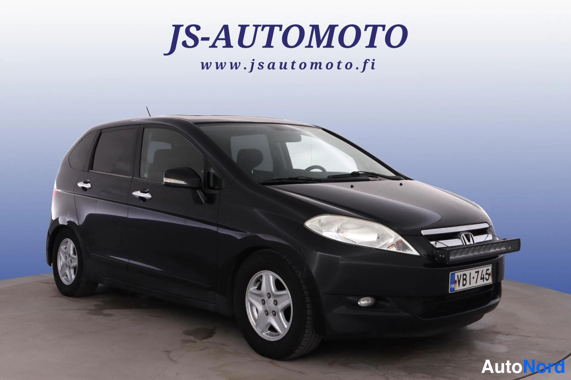 Musta Honda FR-V 2005, etuviisto, keula oikealle, kuva 2