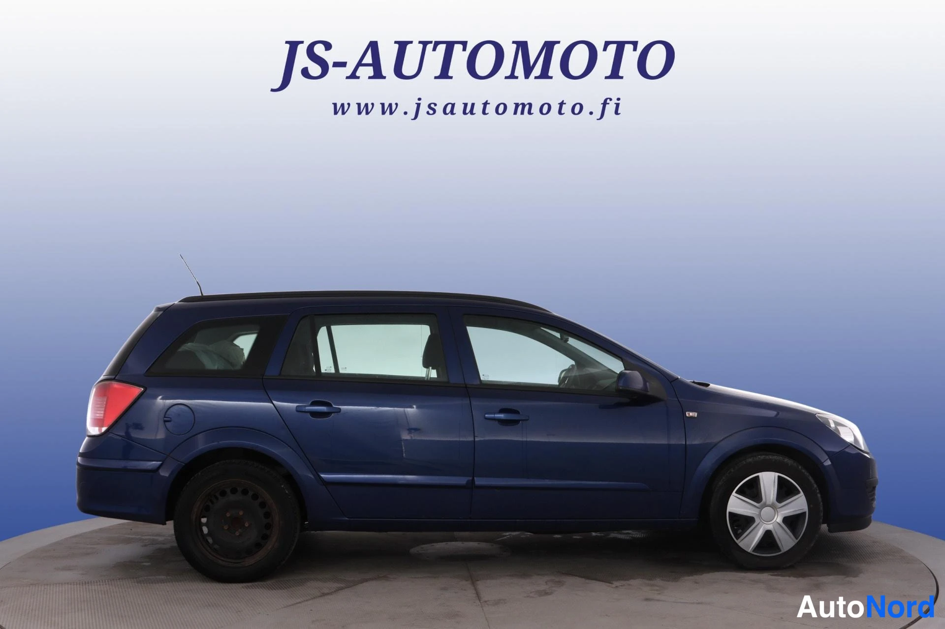 Sininen Opel Astra 2006, sivulta, kuva 4