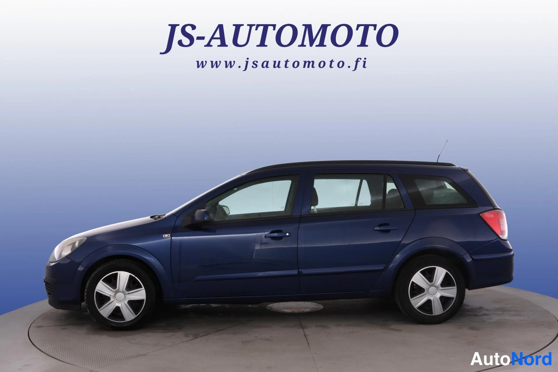 Sininen Opel Astra 2006, etuviisto, keula vasemmalle, kuva 2